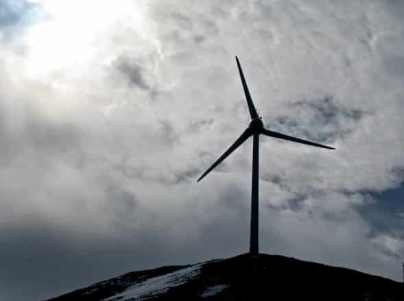 wind turbine with clouds in the background